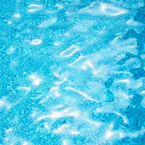 Agua En La Piscina Fondo De La Superficie Del Agua Con Reflejos Solares