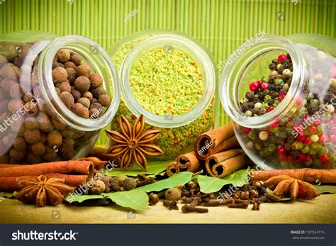 Pack Of Several Spices And Herbs In Glass Jars Stock Photo