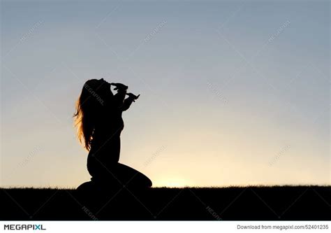 Woman Kneeling In Prayer