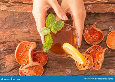 Hands Hold A Glass Of Bael Fruit Tea Stock Photo Image Of Object