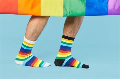 Premium Photo Close Up Shot Of Couple Wearing Rainbow Socks With Lgbtq Flag On Pastel Blue