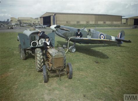 GROUND CREW WORKING ON FLEET AIR ARM AIRCRAFT AT RNAS YEOVILTON