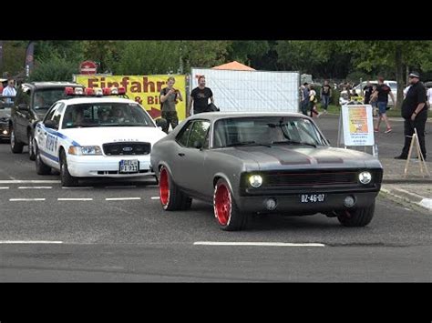 Classic US Muscle Cars Leaving A Car Show In Grefrath Cuda Bel Air