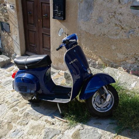 Vespa Scooter Parked On Street In Cortona