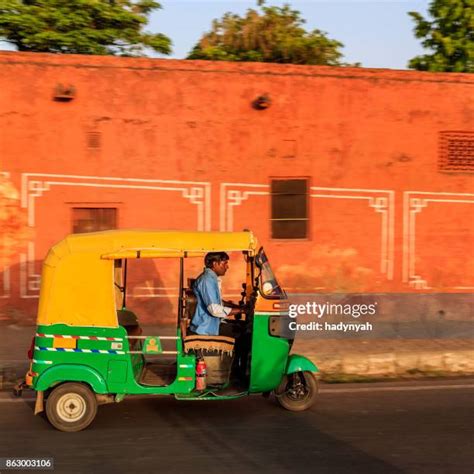 auto rickshaw man stock  high res pictures  images