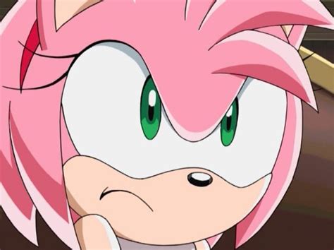 Sonic The Hedgehog Is Looking At Something In Front Of Him With Green