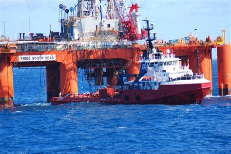 Unloading Under Semi Submersible Oil Rig Of Offshore Tug Supply Vessel