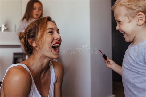 Mother and Son Playing with Makeup Stock Image - Image of indoors ...