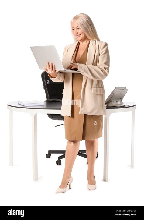 Mature Secretary With Laptop Near Her Workplace On White Background Stock Photo Alamy