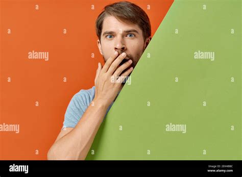 Bearded Man In Gray T Shirt Green Mockup Poster Orange Background Stock