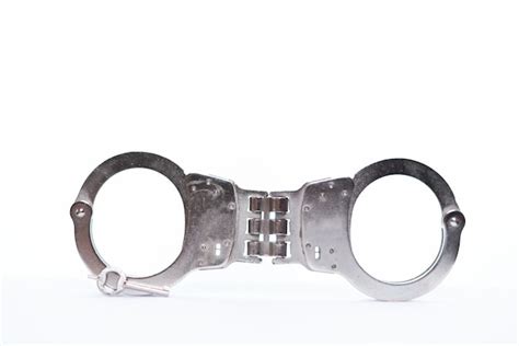 Premium Photo Handcuff With Key On White Background