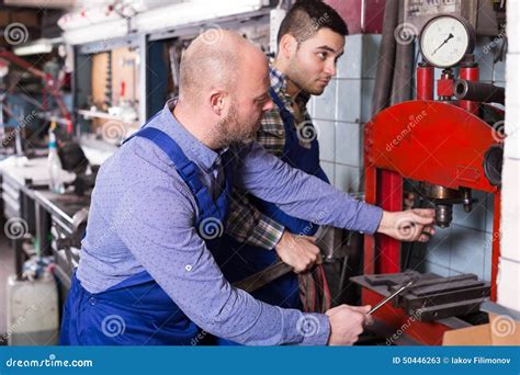 Mechanics Working At Workshop Stock Image Image Of Machinery Fixing