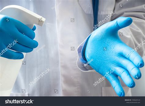 Process Disinfecting Hands Wearing Gloves Antiseptic库存照片1703629123