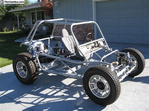 An Off Road Vehicle Parked In Front Of A House