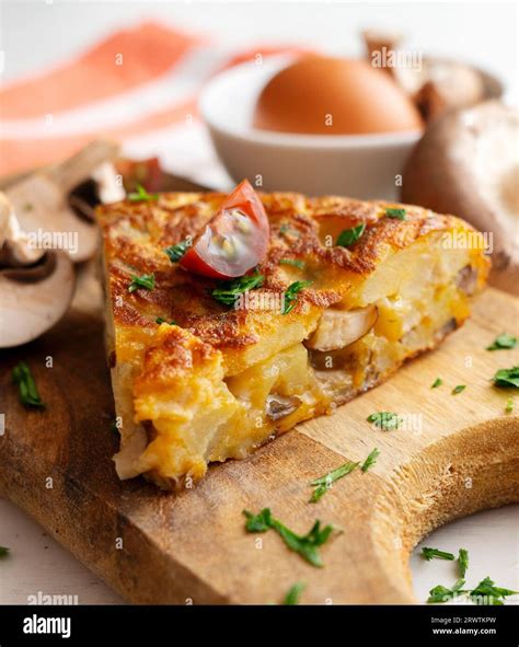 Spanish potato omelette with mushrooms. Traditional tapa Stock Photo - Alamy