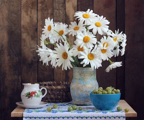 Premium Photo Country Still Life With Daisies And Green Gooseberries