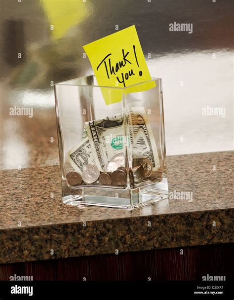 tip jar with thank you note Stock Photo - Alamy