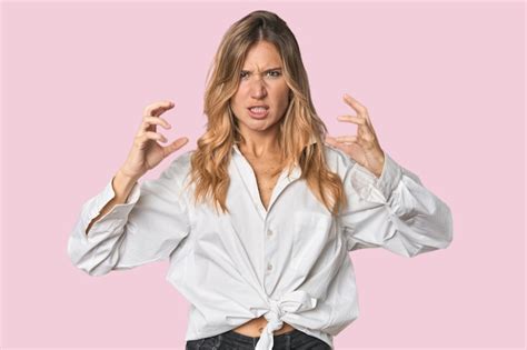Premium Photo Caucasian Blonde Woman In Studio Screaming With Rage