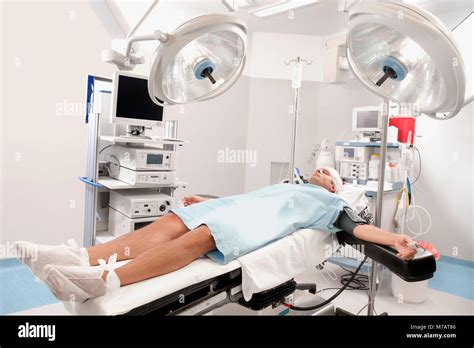 Patient Lying Down On An Examination Table Hi Res Stock Photography And