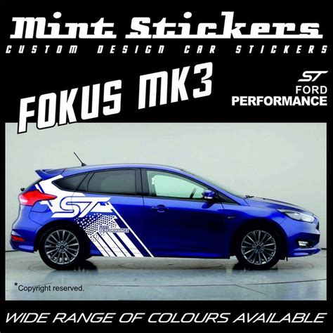 A Blue Car With An American Flag Decal On It S Side And The Words Foxus Mk3