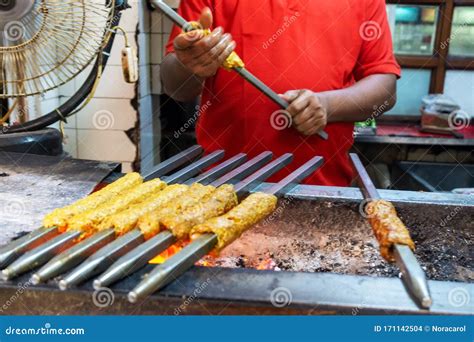 Unidentified Man Grilling an Indian Chicken and Mutton Kebabs at ...