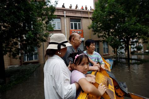 Flooded rivers and trapped residents after Typhoon Doksuri hits China ...