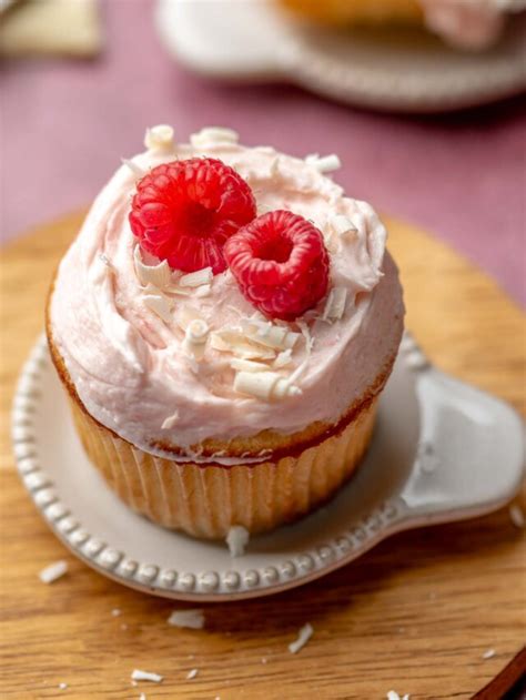 Raspberry Filled White Chocolate Cupcakes The Cozy Plum