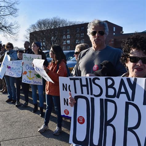 Protesters March From State House To Marriott In Opposition To Offshore