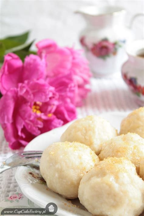 Some Food Is On A White Plate With Pink Flowers And Teacups In The