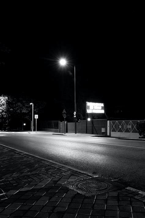 Street Lights near Buildings Illuminated at Night Time · Free Stock Photo