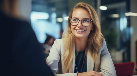 Premium Photo A Woman With Glasses At An Interview With Applicants