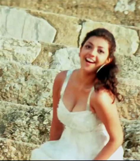 Kajal Agarwal Pourudu Telugu 22 Hot Cleavage Hd Caps Indiancelebblog