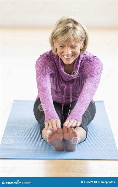 Mature Woman Touching Toes On Yoga Mat Stock Image Image Of Home Mature 46372543