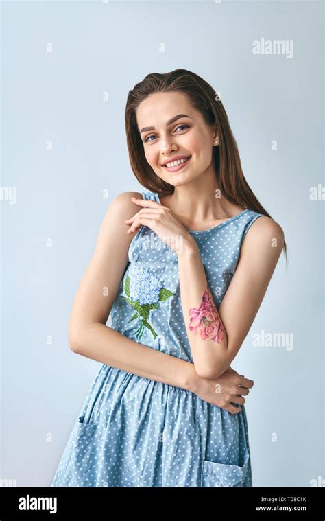 Happy Smiling Beautiful Woman In Polka Dot Dress Posing In Studio