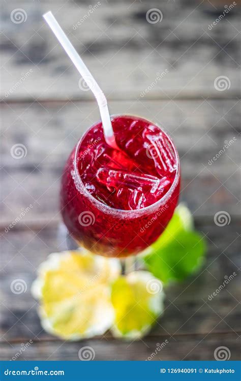 Roselle Juice On Ice Organic On Brown Wood Floor For Healthy Stock