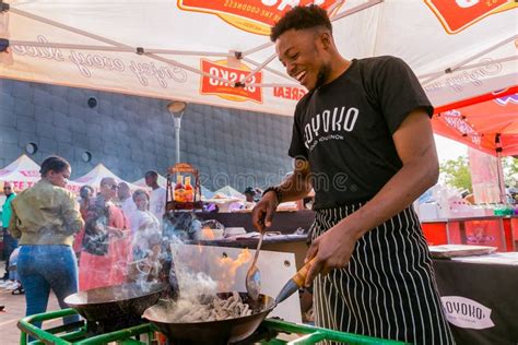 Diverse African Vendors Cooking And Serving Various Bread Based Street