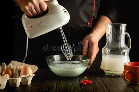 The Chef Prepares An Egg Omelette With Milk Using A Hand Held Electric Mixer Delicious