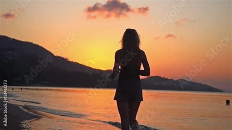 Stock Video Of Woman Walking In Tropical Beach At Sunset In Slow Motion