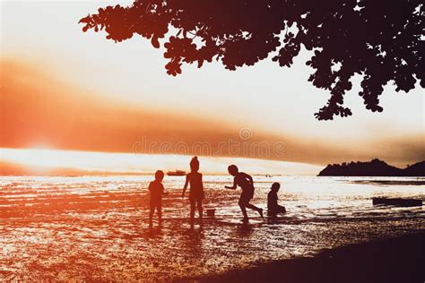 Silhouette of Children Playing at the Beach during Sunset at Koh Chang Thailand Stock Image ...