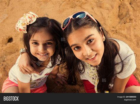 Two Indian Beauties Playing Telegraph