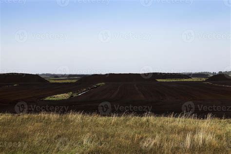 extraction of peat 9451775 Stock Photo at Vecteezy