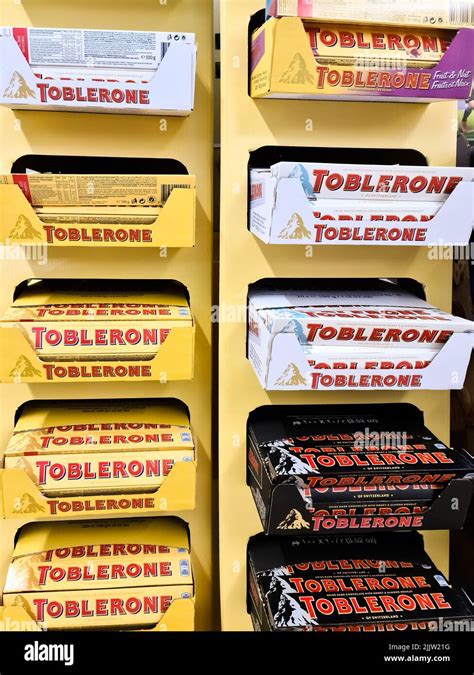 A large display with chocolate different varieties of the brand Toblerone in a supermarket Stock ...