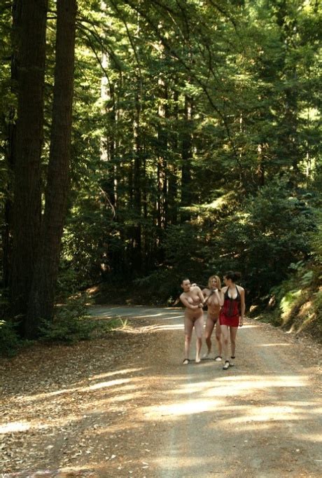 Femdom Princess Donna Dolore Strolls With Naked Female Subs Outdoors