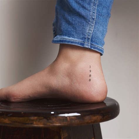 1988 Lettering Tattoo On The Ankle