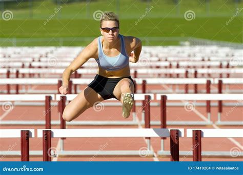 Athlete Jumping Over Hurdles Stock Photo Image Of Field Fast