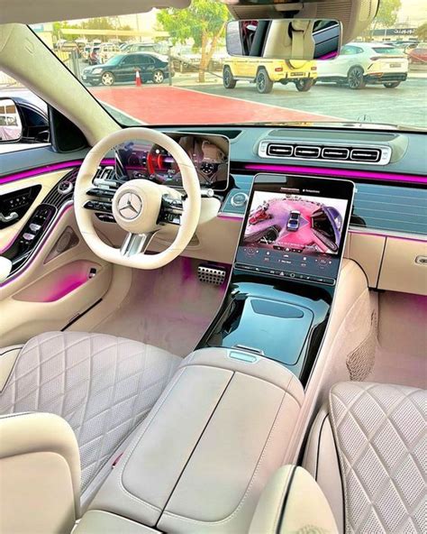 The Interior Of A Mercedes S Class Sedan With Pink And White Leather