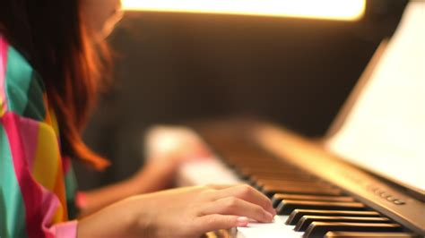 Close Up Of A Little Students Hand Playing The Piano Happy Young