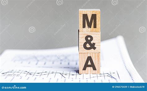 Text Ma Mergers And Acquisitions Acronym Concept On Cubes And