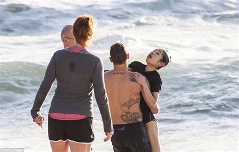 Terrifying moment a drowning swimmer is plucked from the surf by hero lifesavers | Daily Mail Online