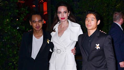 Angelina Jolie Poses With Sons Maddox And Pax At Film After Party In